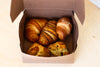 Bakery Box: A selection of croissants, scones, muffins, cookies & loaves.